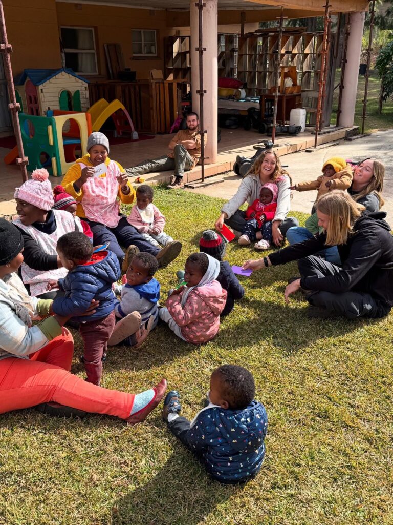 Beyond Survival team & our aunties, playing with our babies